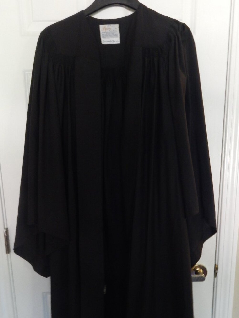 Graduation gown, cotton and polyester blend.